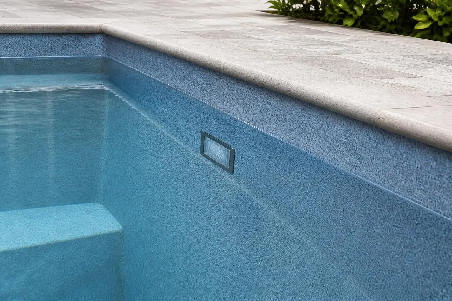 A freshly resurfaced pool interior with a smooth new finish.